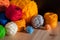 Still life with various yarn for knitting and crochet on wooden background