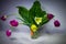 Still life. Vase of flowers tulips standing on the table in pain the background. A long exposure.