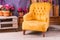 Still Life of Vintage Chair in Living Room.Terrace lounge with comfortable yellow arm chair,divans in a luxury house
