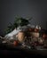 Still life, vintage. cherry tomatoes, laurel, a mill and an old silver knife on wooden table.