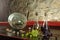 Still life with wine glasses, wine bottles and grapes in old cellar