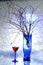 Still life. A winter bouquet. The blue vase. A glass of wine. Snow. Cold.