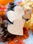 Still Life of Wooden Hearts Amongst Autumn Foliage