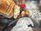 Still life with word Breakfast on the flour. Wooden table with knife, cloth, and meals, top view. Sliced bread with the