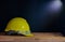 Still life yellow helmet on table