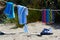 Still picture of towels drying on the beach on a rope