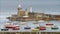 Still shot of many small boats moored in a harbor