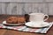 Stilllife with a cup, sugar bowl and saucer with cookies