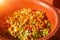 Stilllife from a simple vegetable salad in a clay bowl