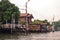 Stilt houses at a klong in Bangkok. Klongs are the canals, that branch off from Chao Phraya river, the big river of Bangkok. The