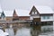 Stilt houses in winter by snow flurry