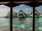 Stilt huts over a tropical lagoon at a resort