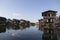 Stilt wooden houses reflecting in Inle Lake village, Shan State, Myanmar