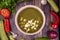 Stinging nettle soup, green borscht with nettle of spring on a wooden table