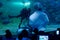 Stingrays and other marine fish gather around a scuba diver, who is performing a live feeding show