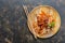 Stir-fred Chinese glass noodles with meat and vegetables, top view. Copy space.