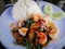 Stir Fried Basil with Seafood on white dish. Key ingredient squid, shrimp , Mussels