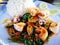 Stir Fried Basil with Seafood on white dish. Key ingredient  squid, shrimp and Mussels