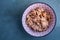 Stir fried chicken with black soy sauce  in a japanese bowl on green iron tray, asian homemade style food concept, Oblique view