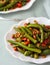 Stir-fried green beans with chili and pepper in a plate. Lady Finger okra vegetable food