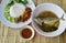 Stir fried minced pork with yellow curry paste and mackerel spicy soup