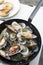 Stir-fried sea mussels in pan