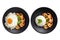 Stir-fried shrimp with basil, Thai street food, arranged on a black plate with a fried egg. Spicy Thai food separated from the