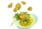 Stir-fried shrimp with egg and yellow curry floating on dish in white background