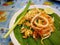 Stir-fried Thai style small rice noodles with squid