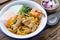 Stir fried yellow noodles with seafood , pork and soft-boiled egg , local folk south thai style