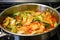 stir fry kimchi being cooked in a hot pan