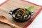 Stir Fry Papaya Leaves or Tumis Daun Pepaya Made from Boiled Papaya or Cassava Leaves with Spice and Chilli. Usually add Fried