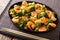 Stir frying shrimp with broccoli closeup. Horizontal