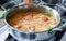 Stirring Brazilian moqueca fish stew