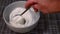 Stirring creamy thick Greek yogurt in a bowl