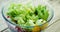 Stock Footage of Closeup - pouring dressing over salad.