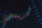 Stock market and economy growth concept with digital rising up financial chart candlestick and diagram on dark blurred