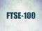 Stock market indexes concept: FTSE-100 on Digital Data Paper background