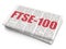Stock market indexes concept: FTSE-100 on Newspaper background
