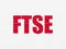 Stock market indexes concept: FTSE on wall background