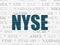 Stock market indexes concept: NYSE on wall background