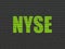 Stock market indexes concept: NYSE on wall background