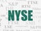 Stock market indexes concept: NYSE on wall background