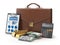 Stock market portfolio concept. Briefcase with calculator, gold