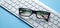 Stock market statistics on eyeglasses. Forex trading analysis