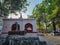 Stock photo of ancient Hanuman temple situated in Gulbarga painted with white and saffron color on the wall.