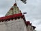 Stock photo of ancient Hindu temple peak of goddess renukadevi or tembalabai Devi. Temple building painted with white and red