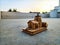 Stock photo of beautiful hand made wooden miniature of Kedarnath Temple kept on floor under natural light. Picture captured at