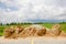 Stock Photo - Concrete barrier blocking the road. sky and clouds