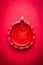 Stock photo of diwali diya or clay lamp over red background, happy diwali